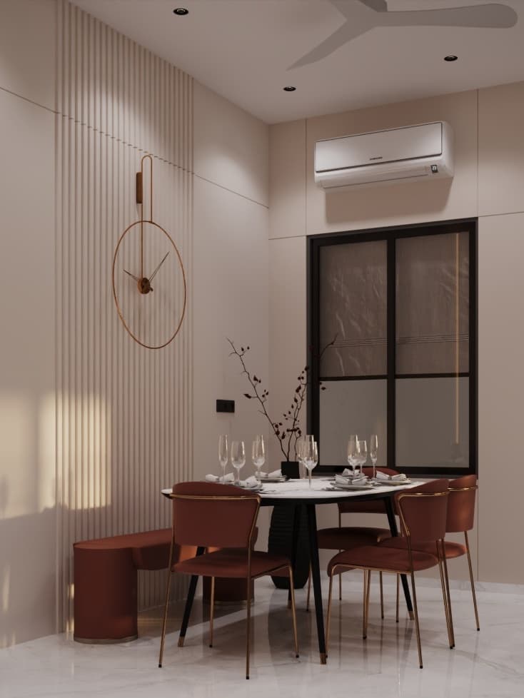 Minimalist dining setup with rust upholstered chairs, marble-top table, fluted wall cladding, and a modern brass clock.
