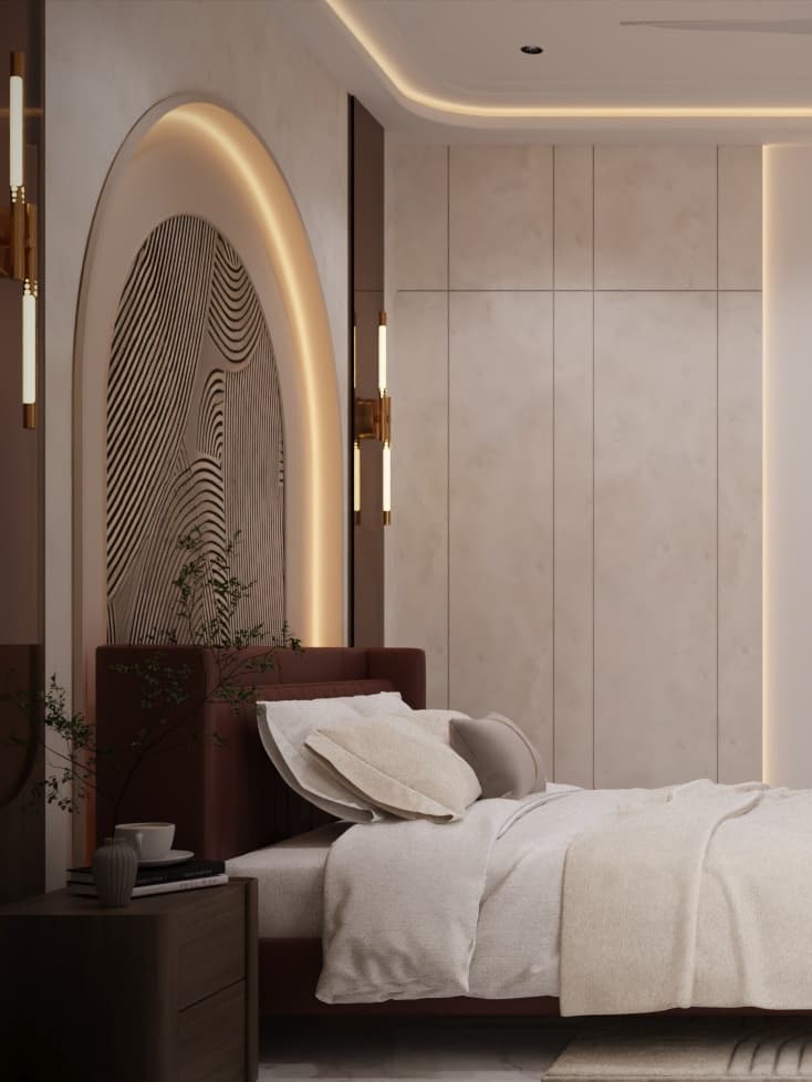 Opulent master bedroom highlighted by a backlit architectural arch, terracotta headboard, and rose-gold tinted glass wardrobes