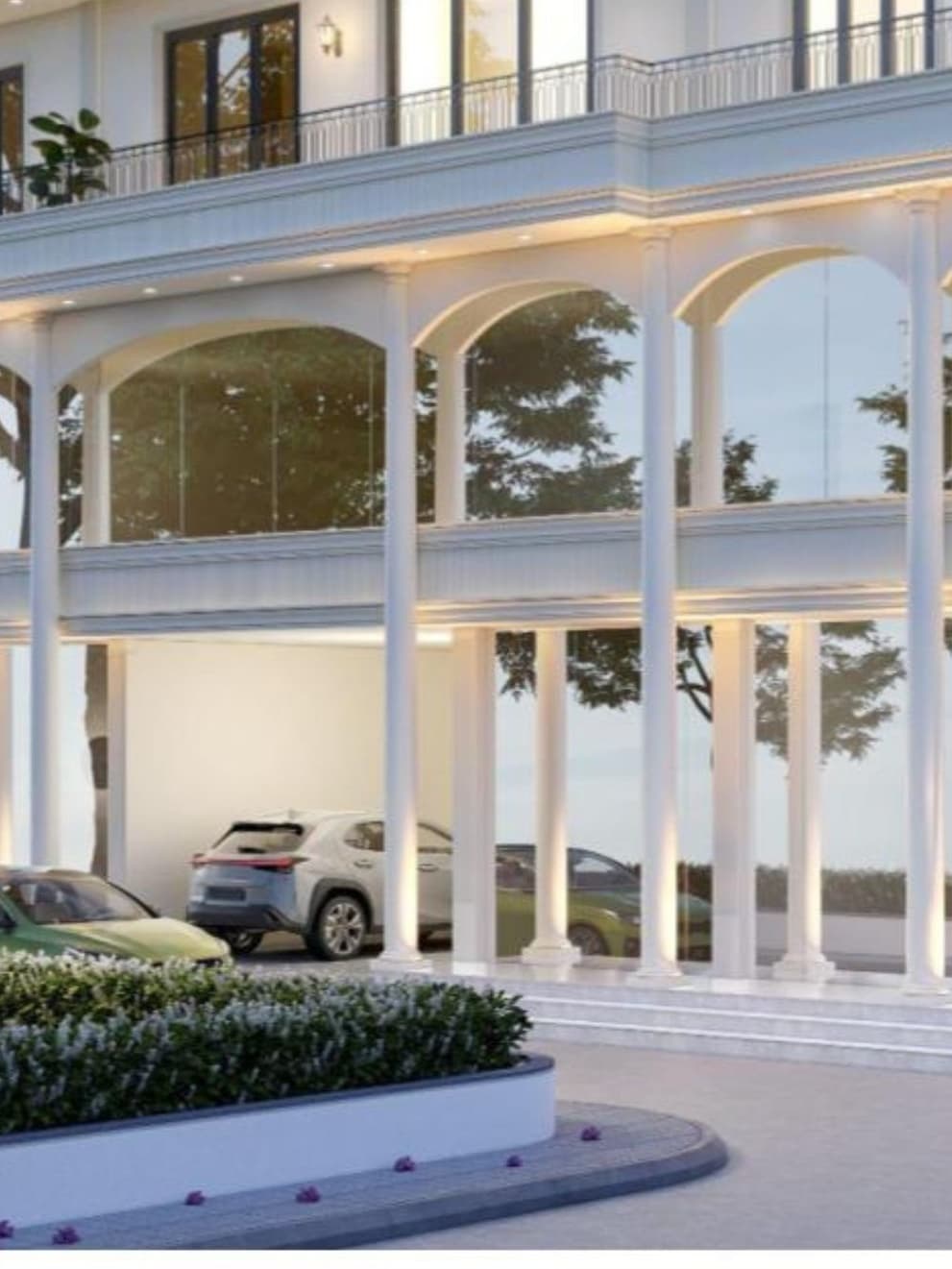 Elegant arched openings supported by slender double columns create a light, transparent base that enhances the building’s refined neoclassical character