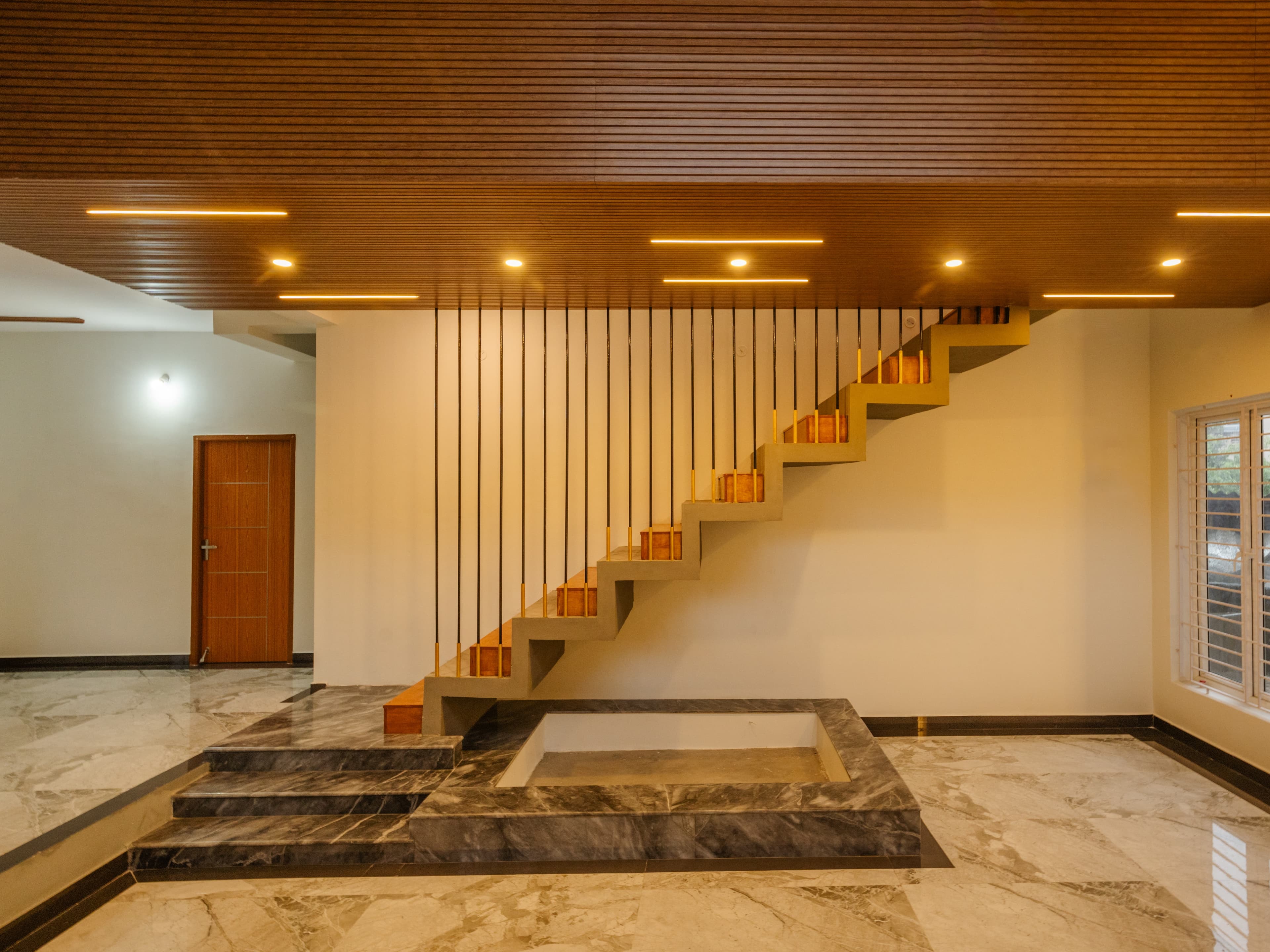 LIVING TO DINING VIEW (FOLDED PLATE STAIRCASE)