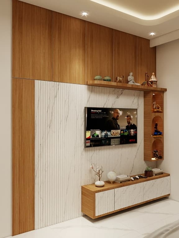 Warm wooden textures blended with marble accents create a sophisticated bedroom featuring modern TV unit, soft lighting and beautifully curated decorative shelves.
