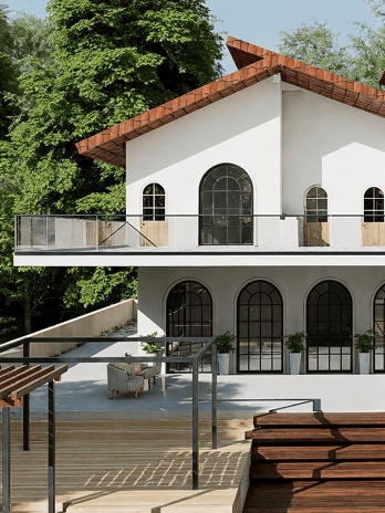 Arched windows, tiled gable roofs, and white stucco walls create a soft, timeless Mediterranean-tropical harmony.