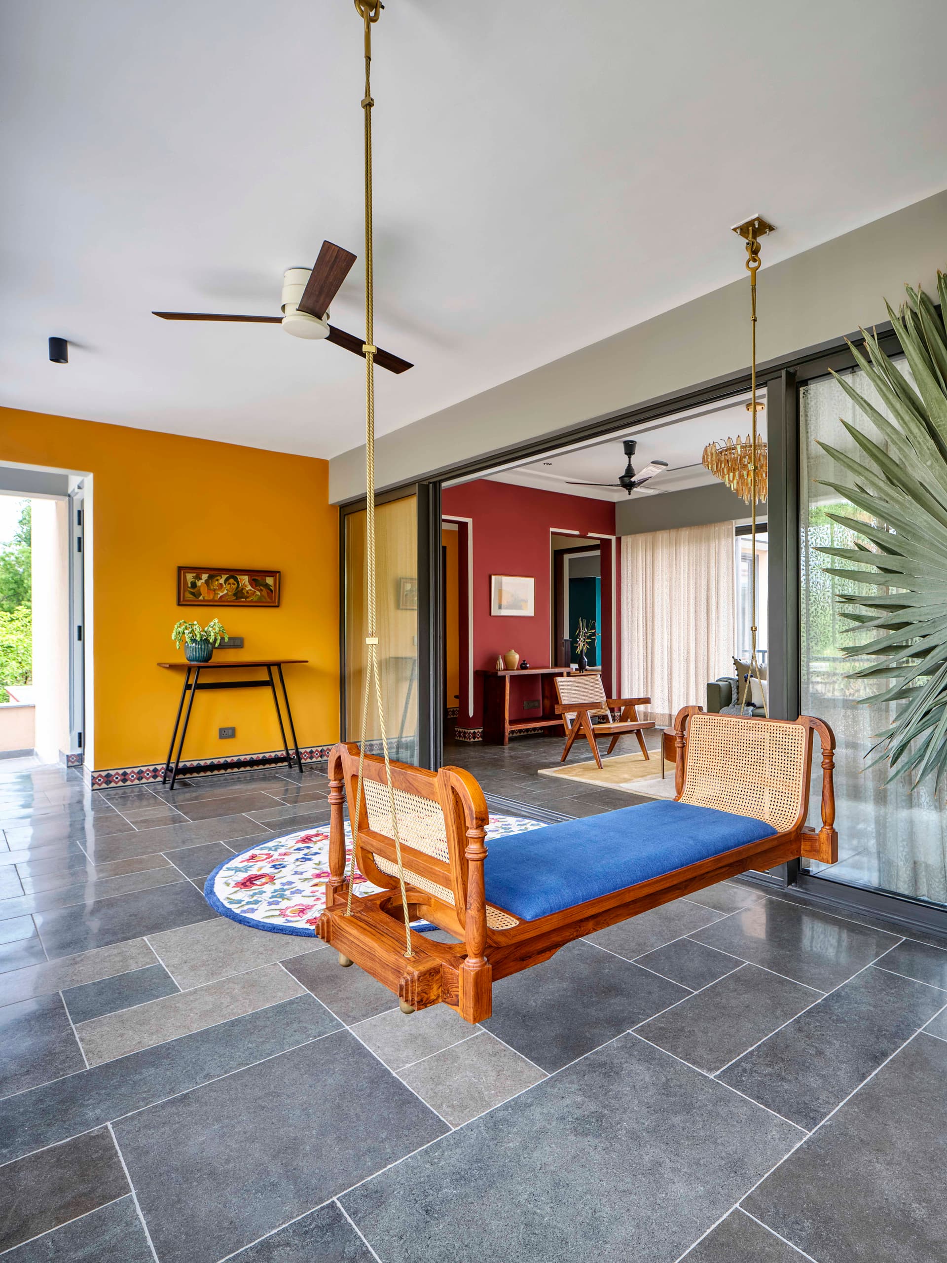 Where modern minimalism embraces vintage character—an architectural symphony of bold walls, chic furniture, and curated art.